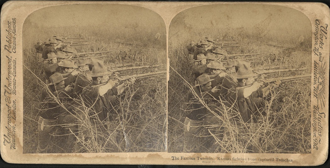 The Famous Twentieth Kansas fighting from captured Trenches.